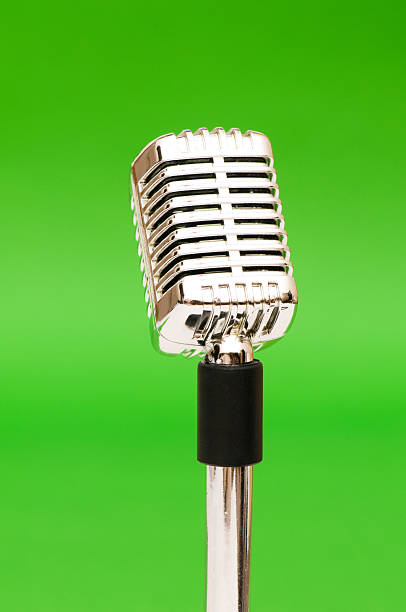 istock Vintage microphone against the bright green background 92222031