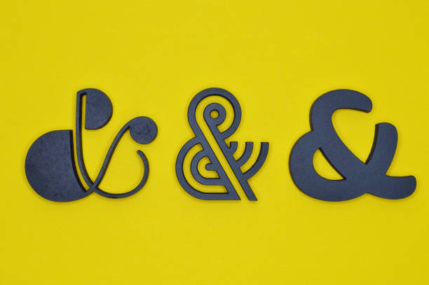 istock three black ampersand characters on yellow background 922221166