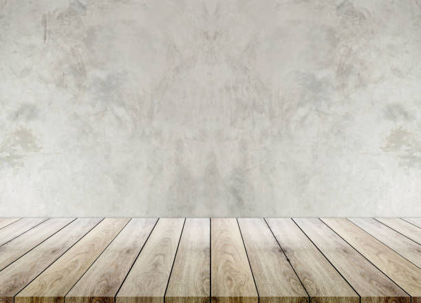 istock Wooden empty table top with cement background, can be used for display your products. 922221616