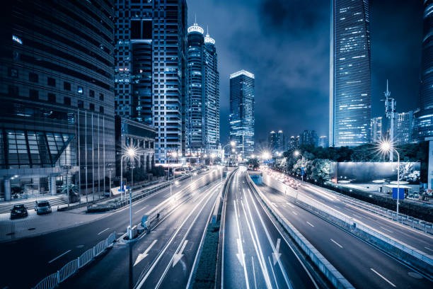 notte moderna della città di shanghai - light trail shanghai city street city foto e immagini stock