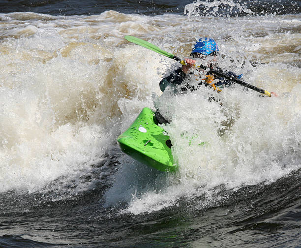 istock Green Kayak Blue Helmet 92222399