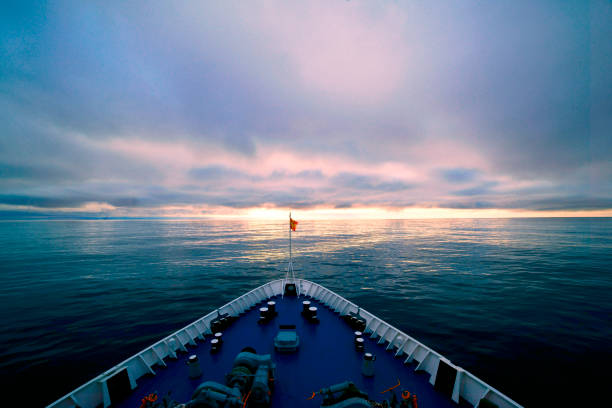 Ship in sea distance on sunset background. Ship in the sun