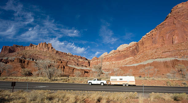istock Pick up with mobile home driving in Utah 92223823