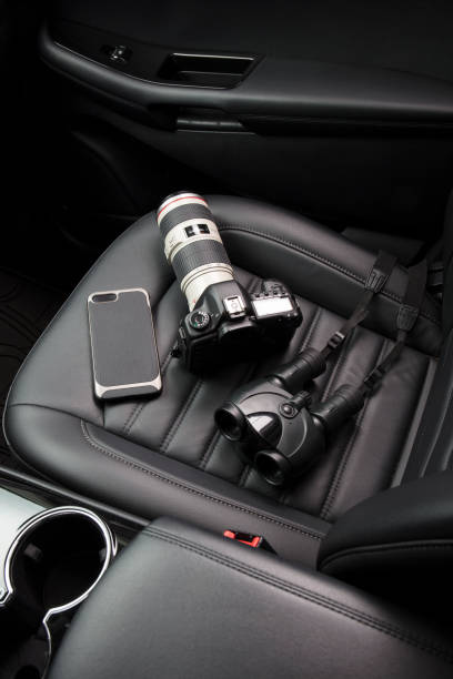 istock Private investigator tools on car seat 922241094
