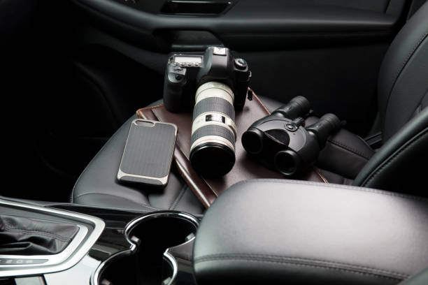 istock Private investigator tools on car seat 922241264