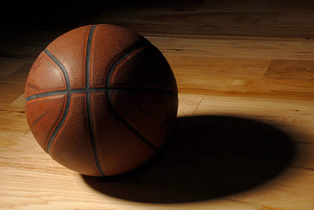 istock Old Basketball in an Empty Gym 92224742