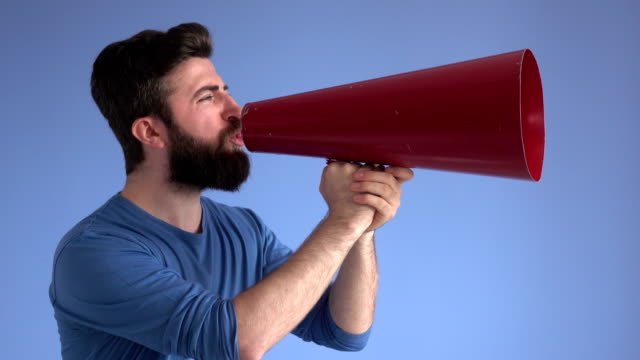 Adult Man Shouting Via Red Old Fashioned Megaphone