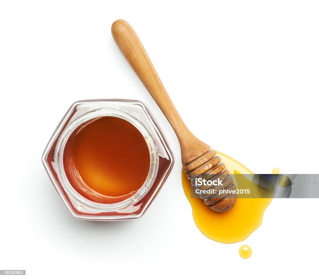 Cenato al miele e brocca su sfondo bianco - Foto stock royalty-free di Miele - Dolci