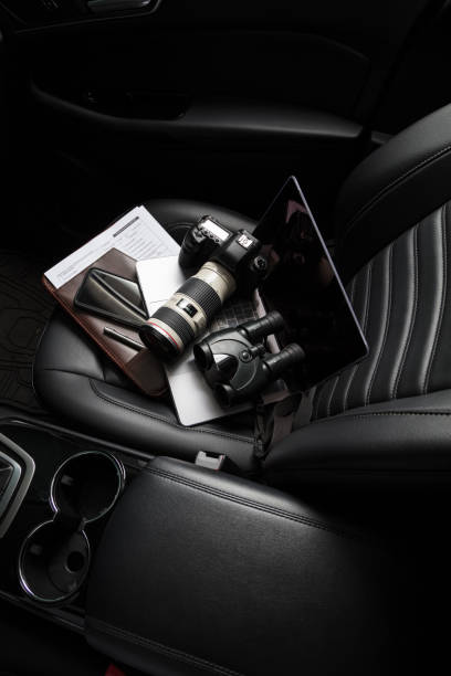 istock Private investigator tools on car seat 922251982