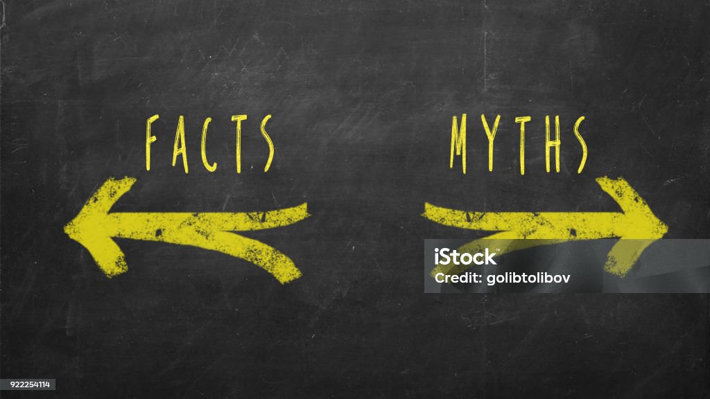 Facts vs Myths CHoice concept. Facts and Myths text drawn with yellow arrows on chalkboard Mythology Stock Photo