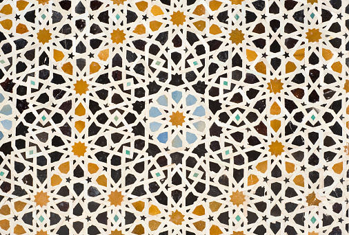 Zellige or Zellij tilework in the Madrasah  Bou Inania in  Fez. Used on walls, fountains, floors, ceilings, tables, it is one of the main characteristics of the Moroccan Architecture.