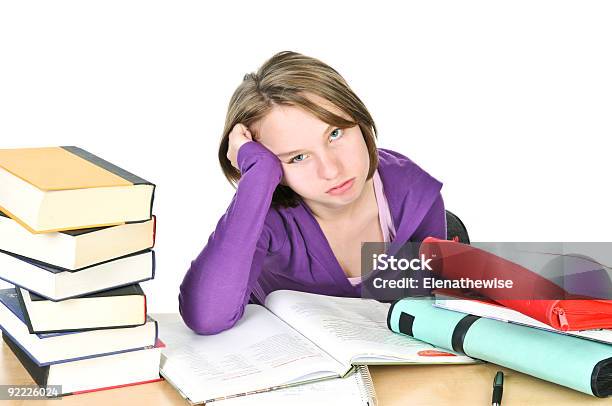 A Teenage Girl At A Desk With Books Studying Stock Photo - Download Image Now - Teenage Girls, Boredom, Homework