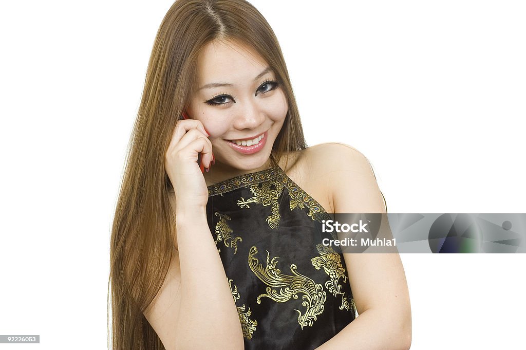 Giovane asiatica ragazza con cellulare. - Foto stock royalty-free di Adolescente