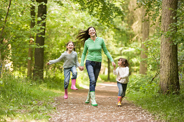 istock Family Running Through Woodland Path 92226369