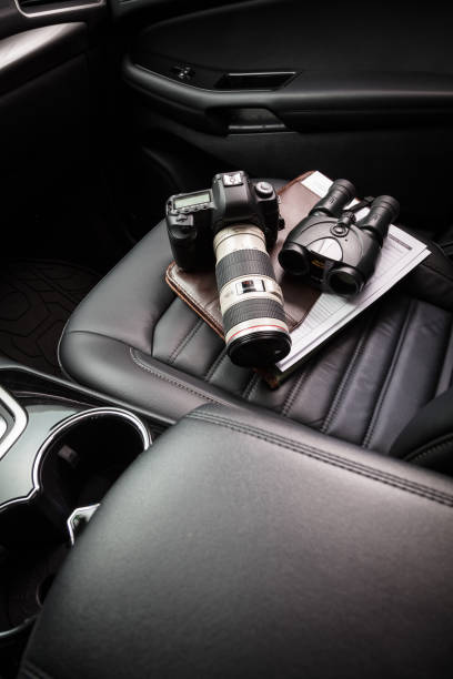 istock Private investigator tools on car seat 922263806