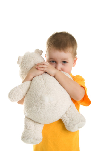 Little boy with teddy bear. Isolated on white. Clipping path.