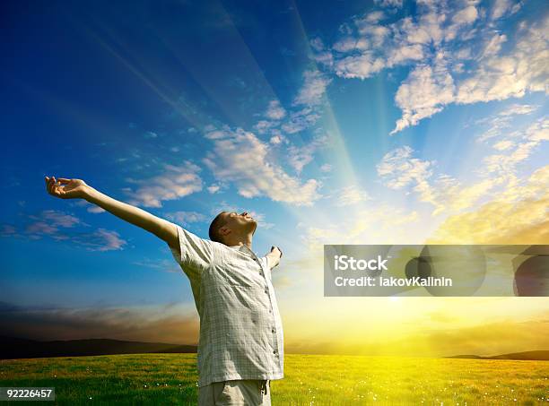 Young Man Relaxing And Embracing Nature At Sunset Stock Photo - Download Image Now - Adult, Adults Only, Agricultural Field