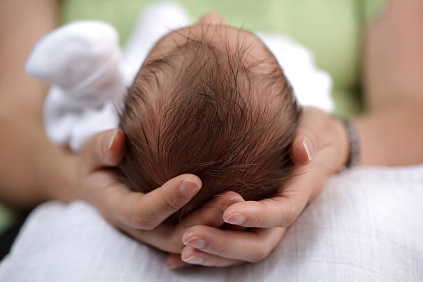 istock Newborn baby in his mothers safe hands 92226485