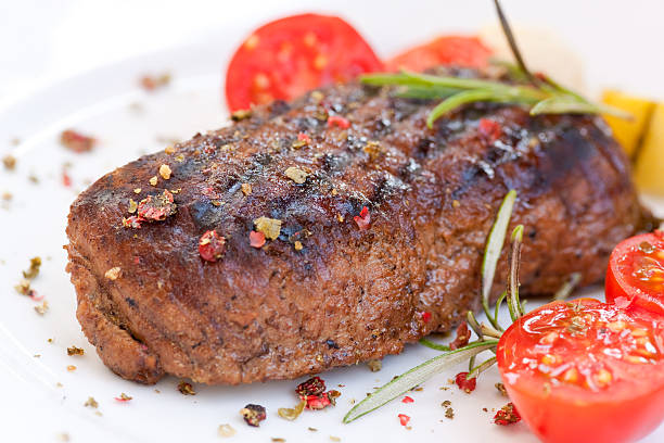 istock Steak meal garnished with cherry tomatoes and herbs 92226554