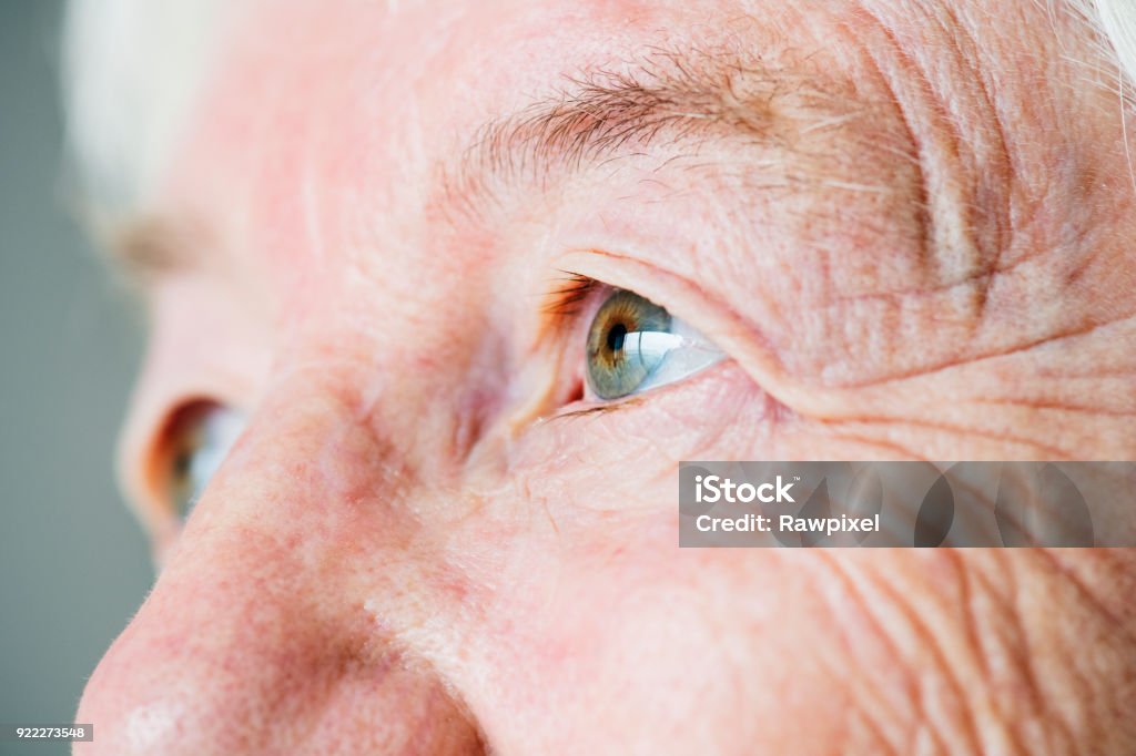 Closeup side portrait of white elderly woman&#39;s eyes Eye Stock Photo