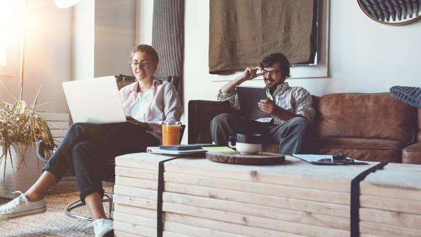 istock Group of two people with laptops in small loft office 922276882