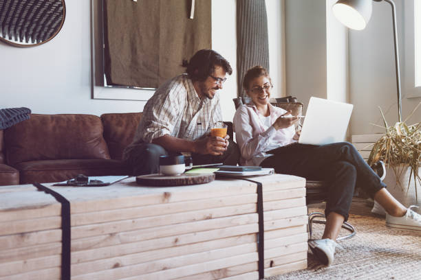 istock Group of two people with laptops in small loft office 922278330