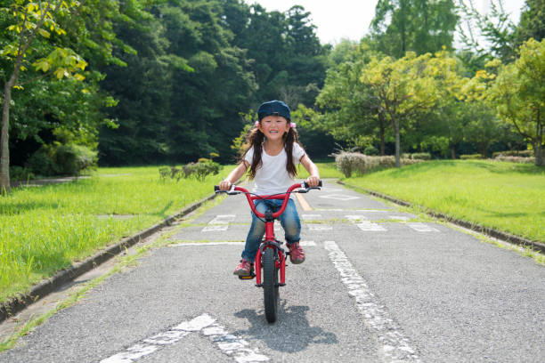 istock Little girl riding a bicycle 922279368