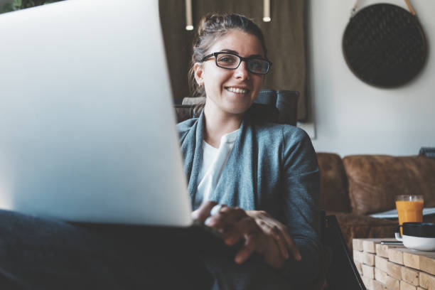 istock Woman working with gadgets in loft office 922283112
