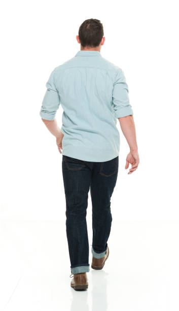 istock Handsome man in casual clothes walking 922287682
