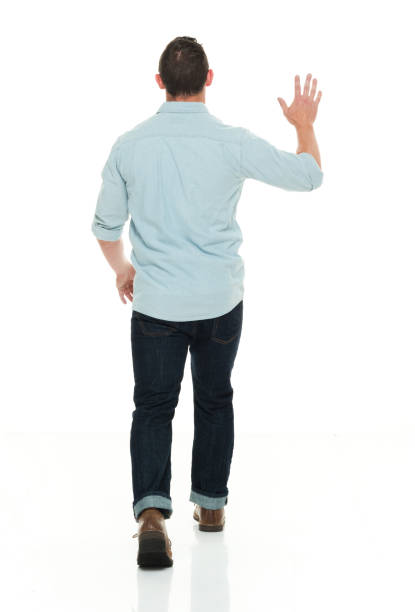 istock Handsome man in casual clothes waving 922288930