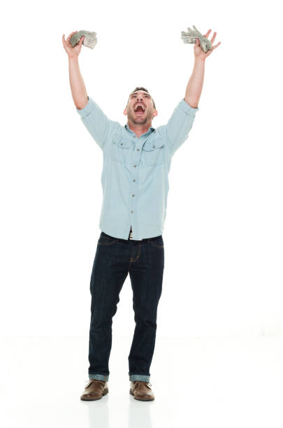 istock Casual man holding hands up with cash 922289048