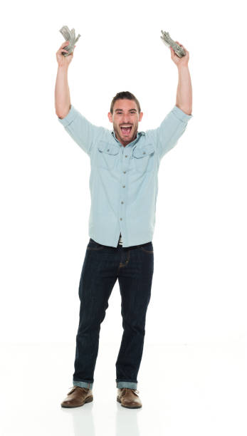istock Casual man holding hands up with cash 922289056