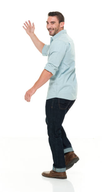 istock Handsome man in casual clothes waving 922289352