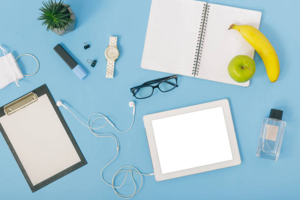 istock Tablet with supplies for education on blue background, top view. Creative education background 922289652