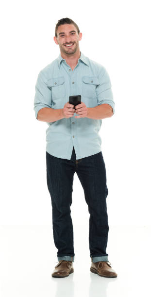 istock Handsome man in casual clothes using smart phone 922292384