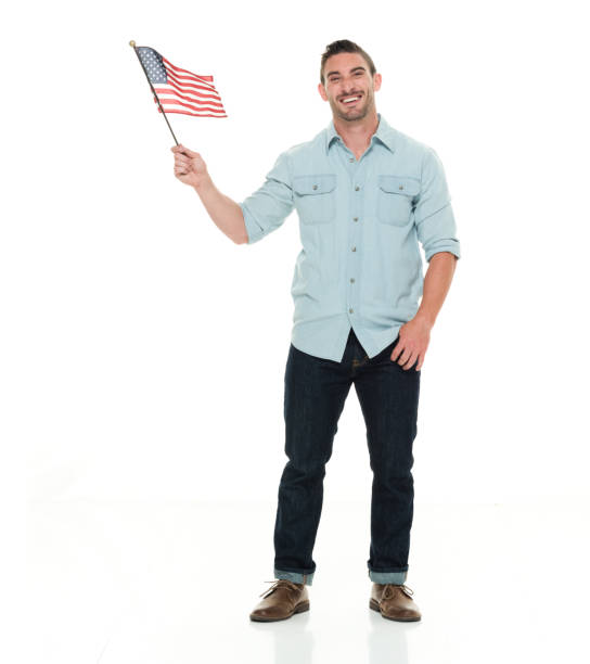 istock Casual man holding small American Flag 922292400