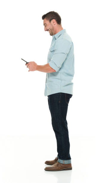 istock Handsome man in casual clothes using smart phone 922292688