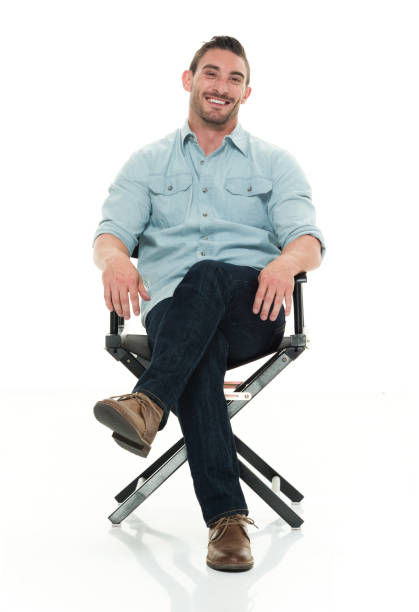 istock Handsome man seated on director's chair 922292714