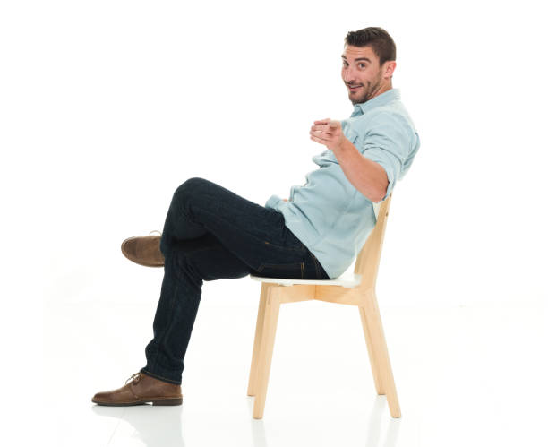 istock Side view of charming man seated 922292960