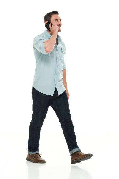 istock Handsome man in casual clothes talking on smart phone 922295178
