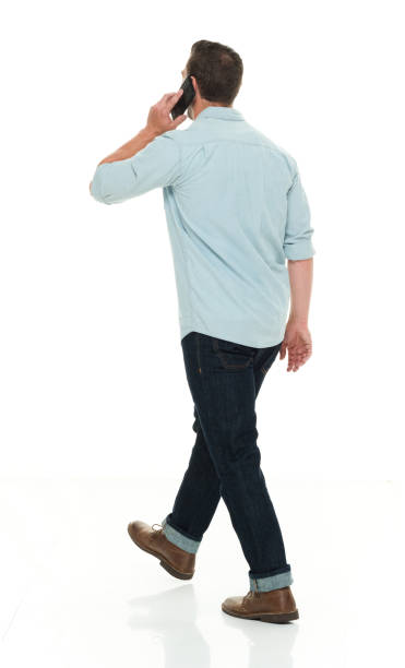 istock Handsome man in casual clothes talking on smart phone 922299400