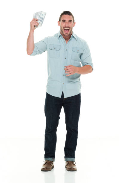 istock Handsome man in casual clothes holding money 922299534