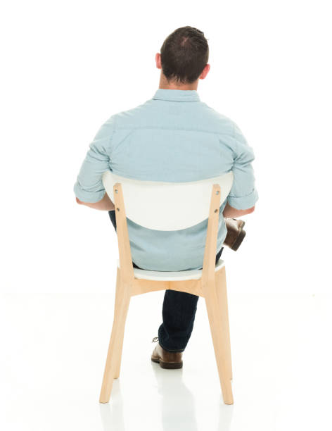 istock Rear view of charming man seated 922299714