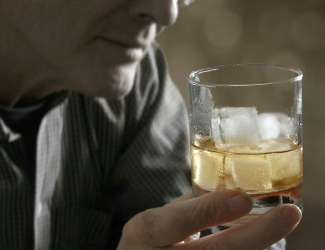 a man enjoying his whiskey