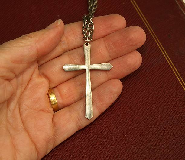 istock Christian cross held in hand. 92230194