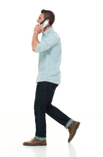 istock Handsome man in casual clothes talking on smart phone 922304246