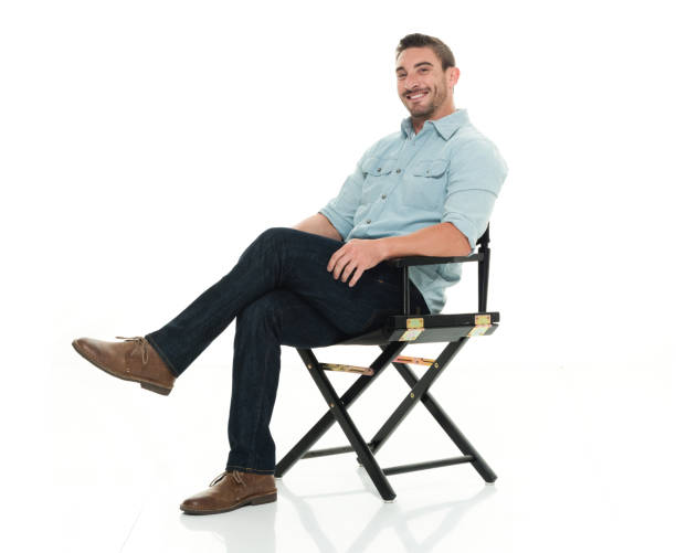 istock Handsome man happy and seated 922304622