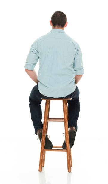 istock Charming happy man seated on wood stool 922304970