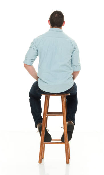 istock Charming happy man seated on wood stool 922304972