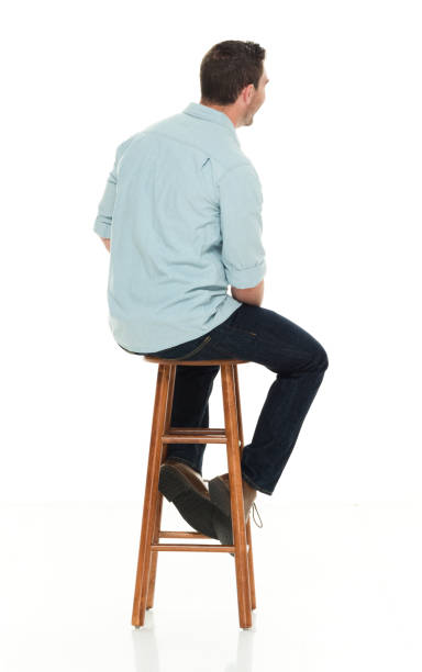 istock Charming happy man seated on wood stool 922305004